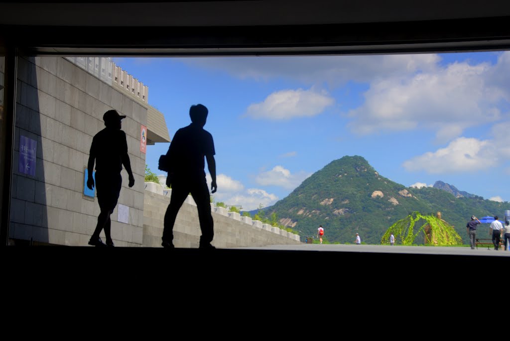 Visitor emerge from Gwanghwamun Station, Seoul, South Korea by Damon Tighe