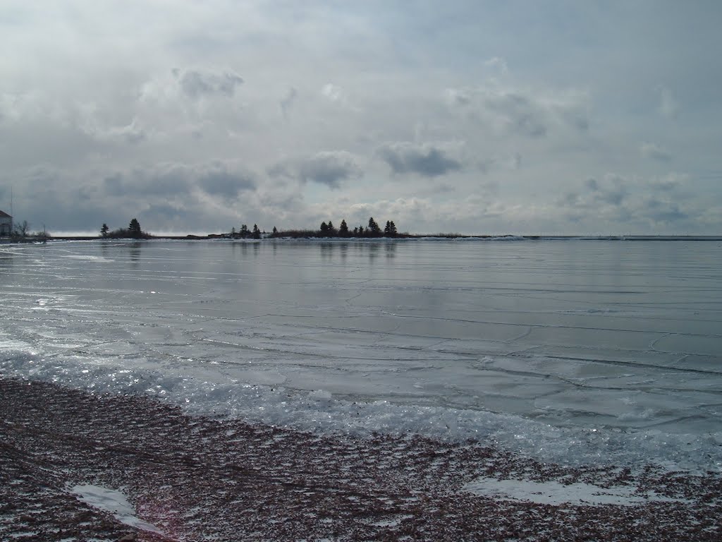 Feb 2006 - Grand Marais, Minnesota. Frozen Grand Marais Harbor. by BRIAN ZINNEL