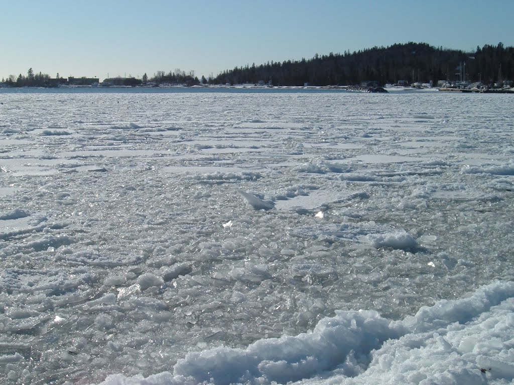 Feb 2006 - Grand Marais, Minnesota. Frozen Grand Marais Harbor. by BRIAN ZINNEL