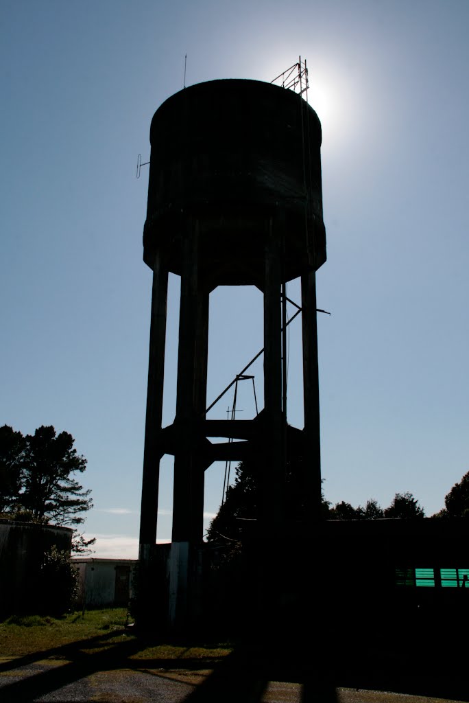 Water tower in silhouette by D B W