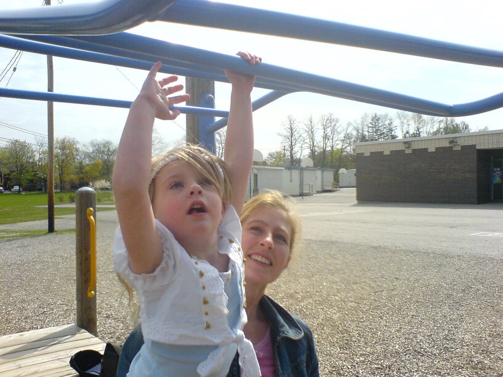 Lauren practicing the monkey bars by Phil McFarlane