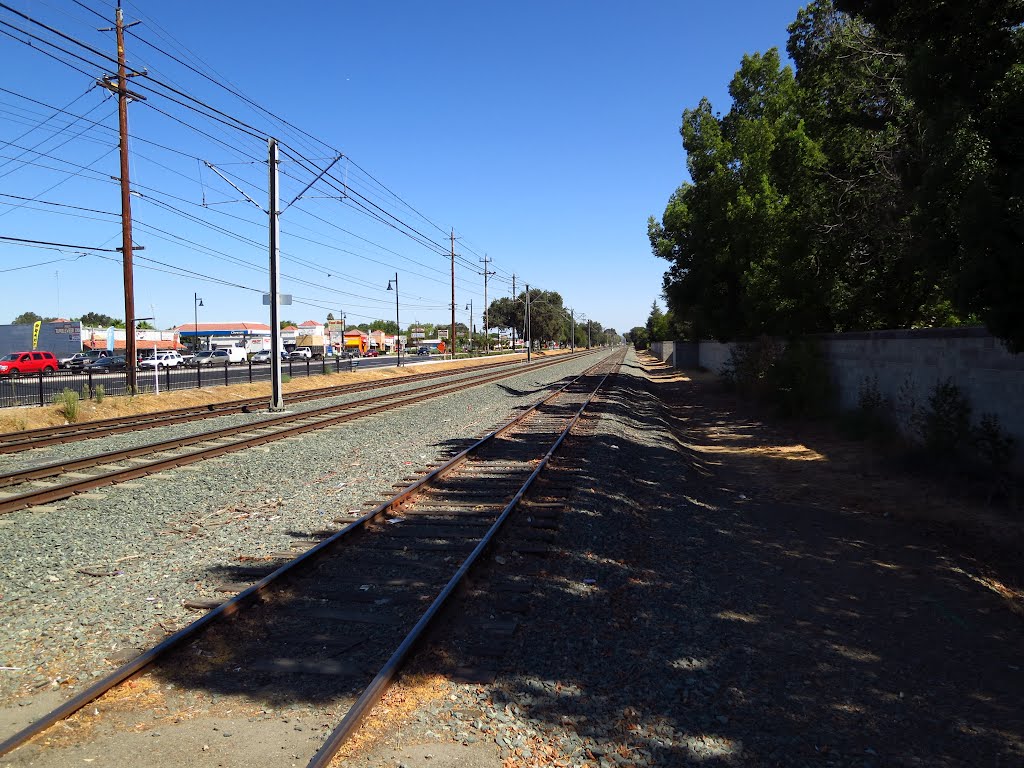 Light rail and railroad track (looking east) by VasMan