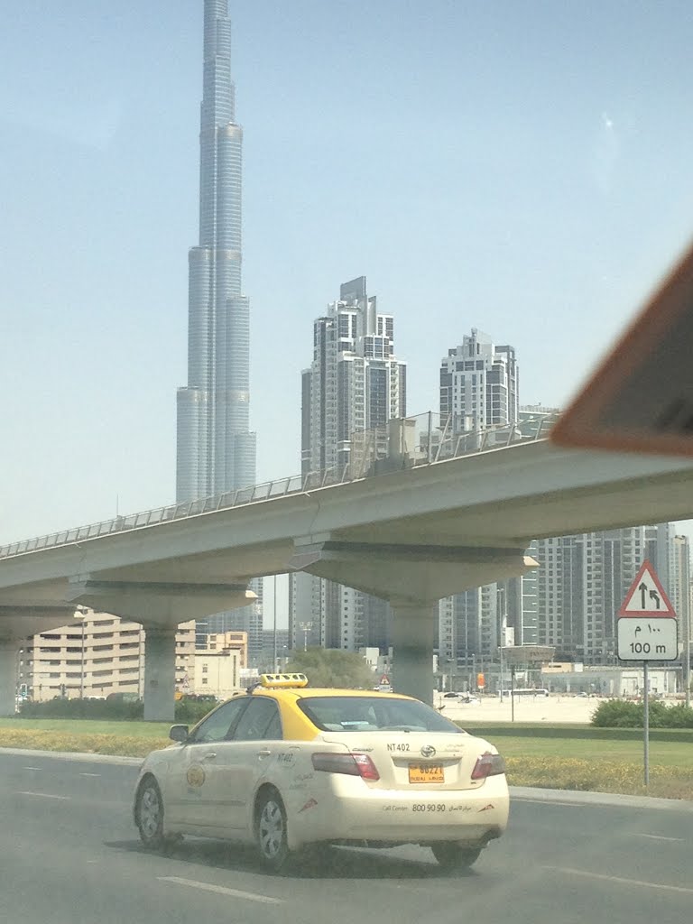 Burj Khalifa tower - Dubai -a view from Sheikh zayed road by the king of a small …