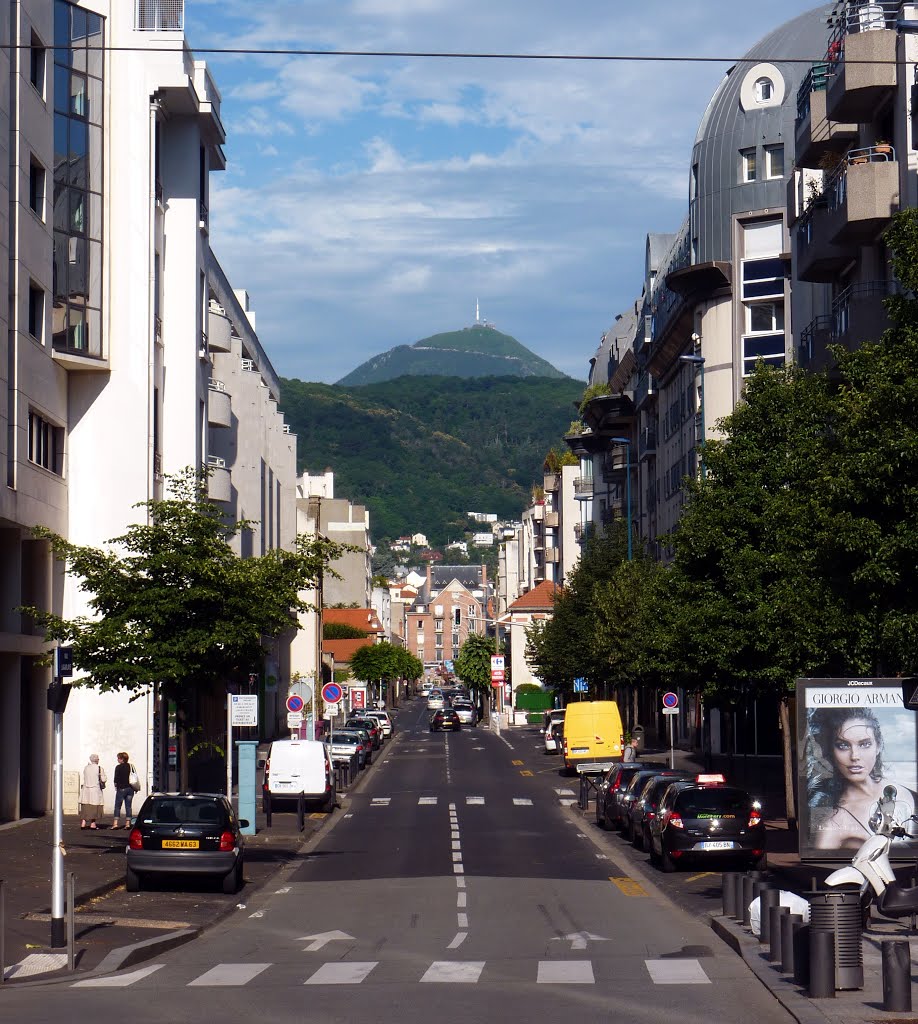 A Clermont-Ferrand's street and Puy du Dome mountain. by spiritualizedkaos