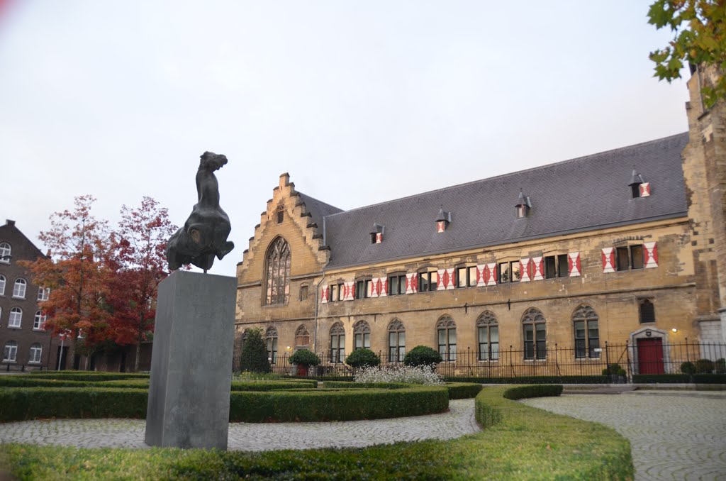 Statue and the ancient Monastry building of Kruisheren Hotel Maastricht by Henq