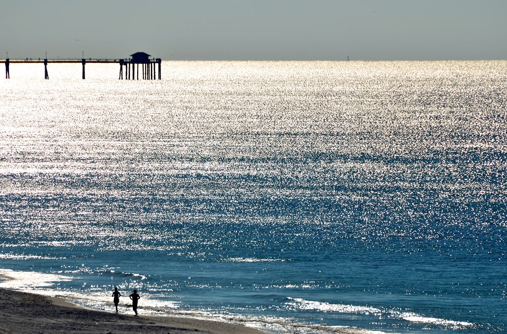 Early morning joggers, Okaloosa Island, FL by Buddy Rogers