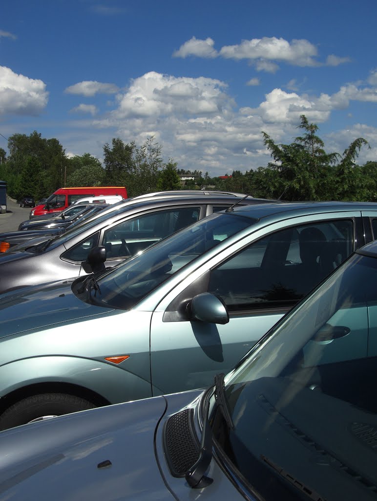 Nice cars and beautiful clouds by Mona Lygre