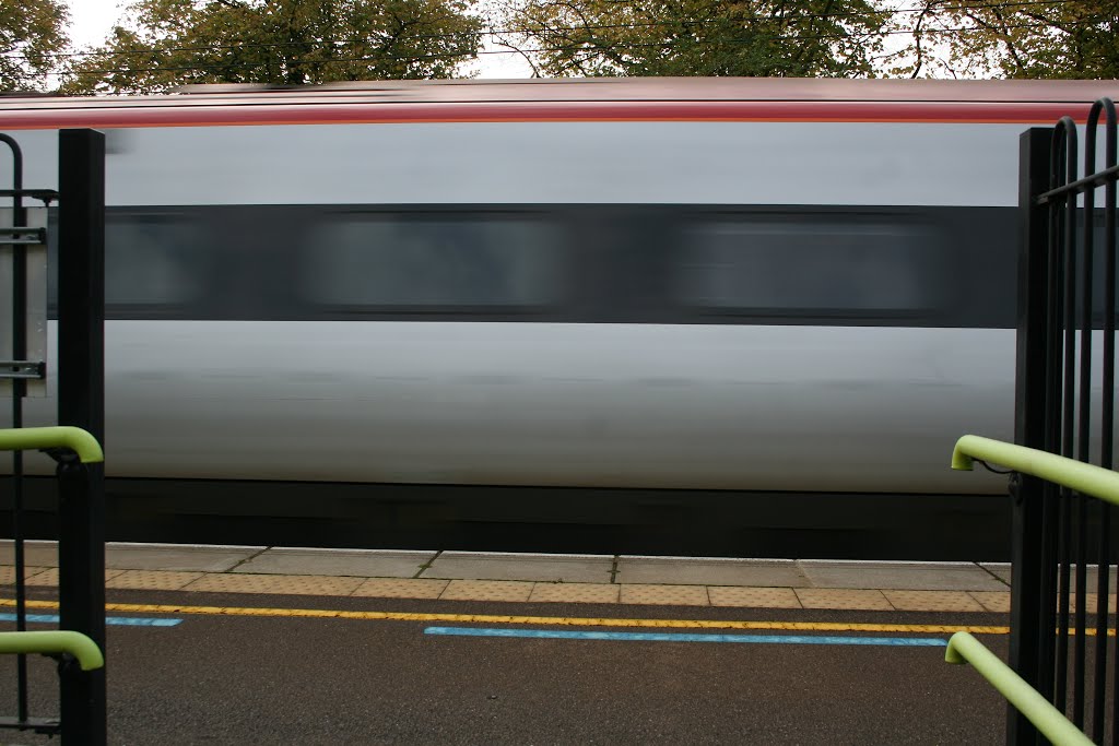 Static and speed: a Pendolino rushes past the railings at Berkhamsted. by melvilla1903