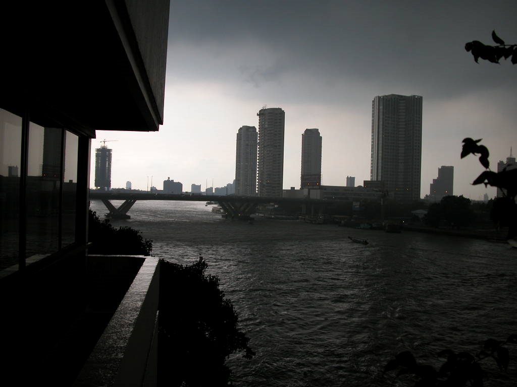 Rain over Chao Phraya River as seen from River Garden by Watcharee