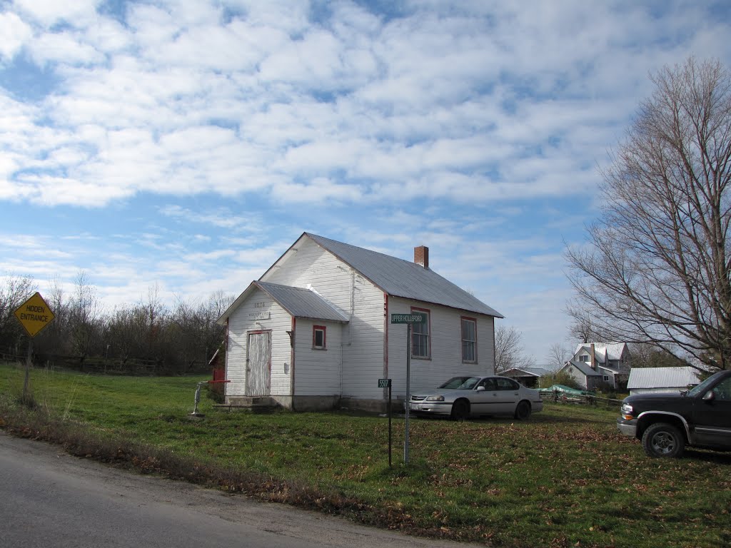 The former Holleford S.S. # 9 & 11, single room public school, built 1874. S. S. stands for School Section which generally served a 2 mile radius. Many other local one room schools were burned the same night, about September 1, 1963 forcing amalgamation of schools. by Steve Manders