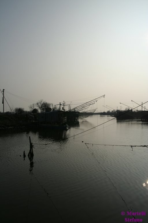 Capanni dei pescatori al tramonto - Parco fluviale del delta del Po' - Stazione di pesca Foce by Stefano Martelli