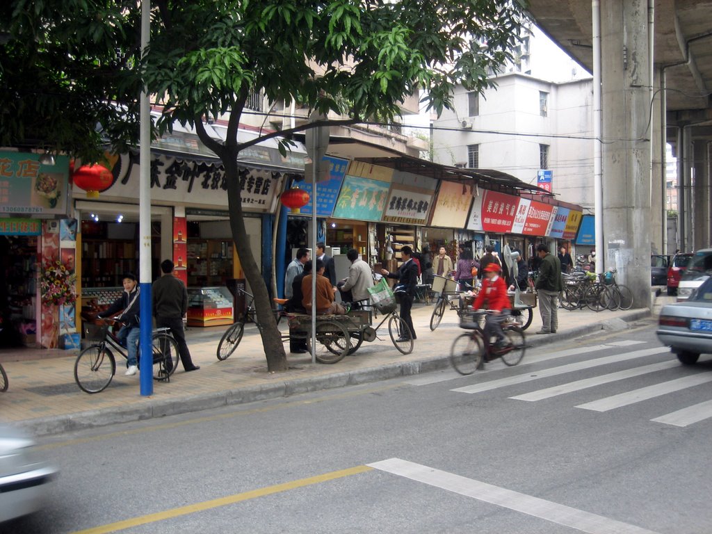 Guangzhou, China. Small shops. by Eivind Friedricksen