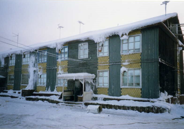 Apartment house in Batagay. Frozen meat and fish (stroganina) is hanging from the windows in plastic bags. Picture taken with -55C. by a.richichi