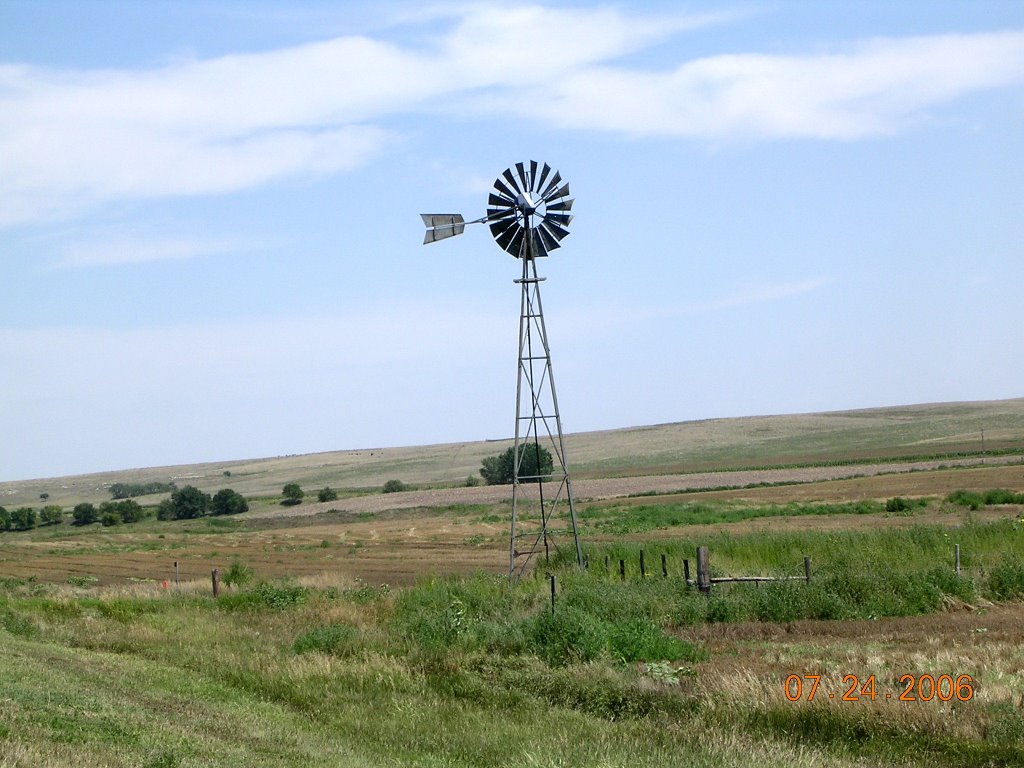 A windmill in rural Kansas along Highway 383 by jiminomaha1