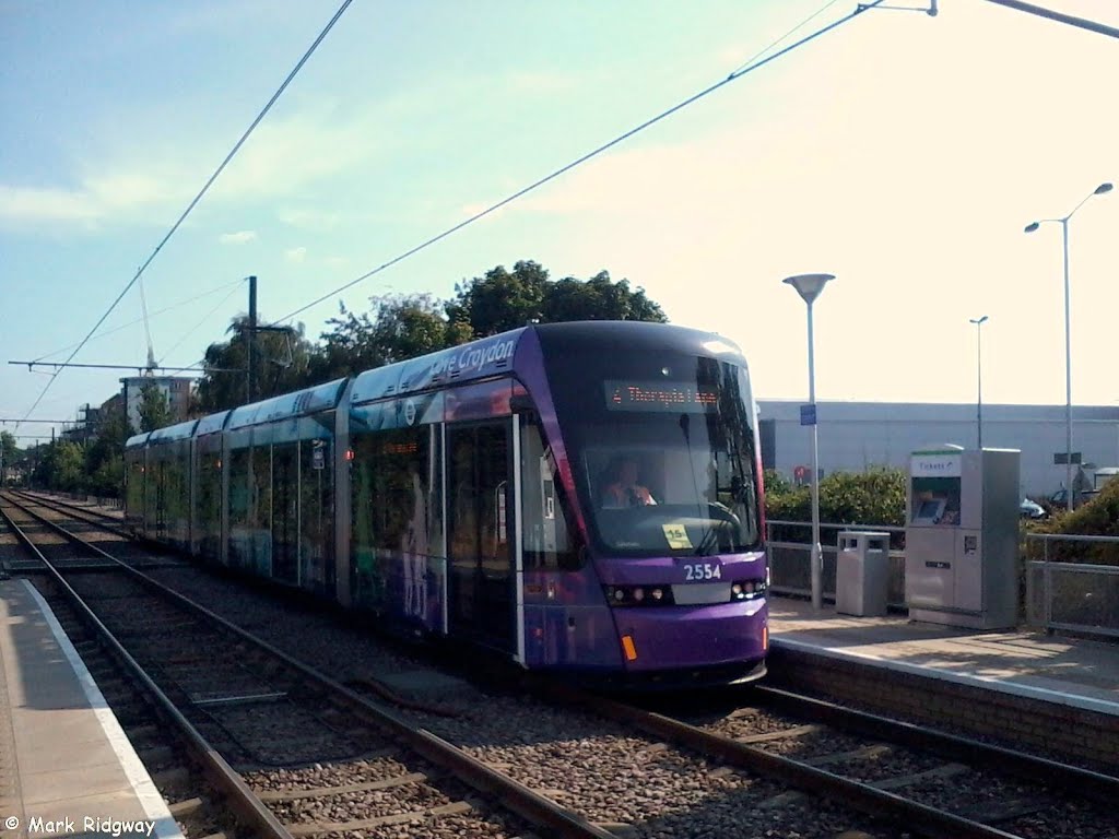 A Tram at Waddon Marsh Tram Stop by Mark Ridgway