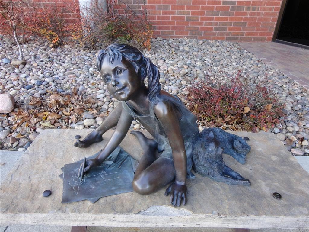 Bronze little girl drawing with cat, Cowley County Community College, Arkansas City, KS by marnox1