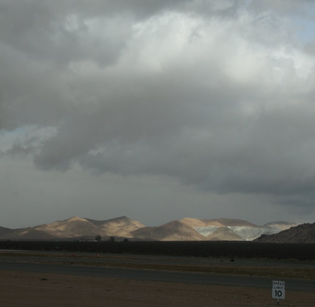 Sunlight breaks through momentarily on Black Mtn. cement quarry NE of Apple Valley Airport by bikecam