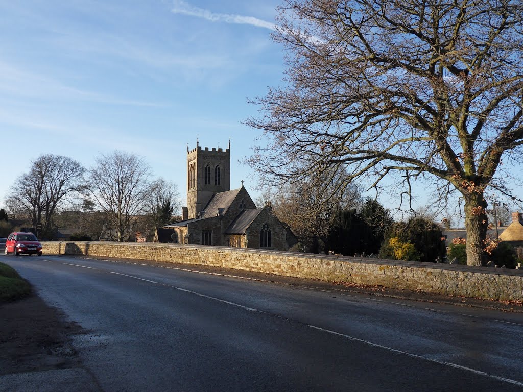 Cold but bright December day on the main road past the village church. by Bobsky.