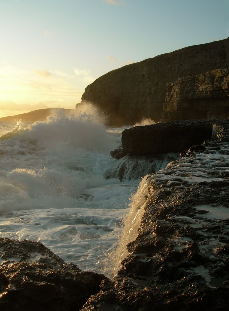 Sea spray and sunset, Winspit quarry ledge by Adrian Farwell