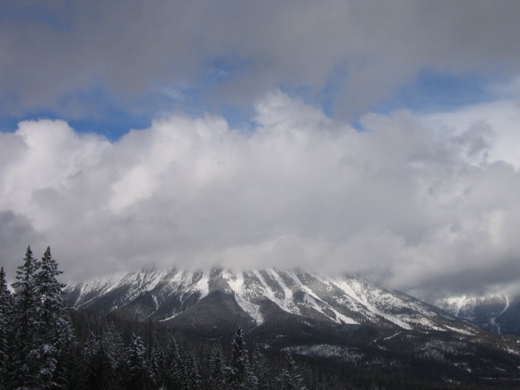 Cloud Bands Passing Through The Mountains And Sun At Fernie BC by David Cure-Hryciuk