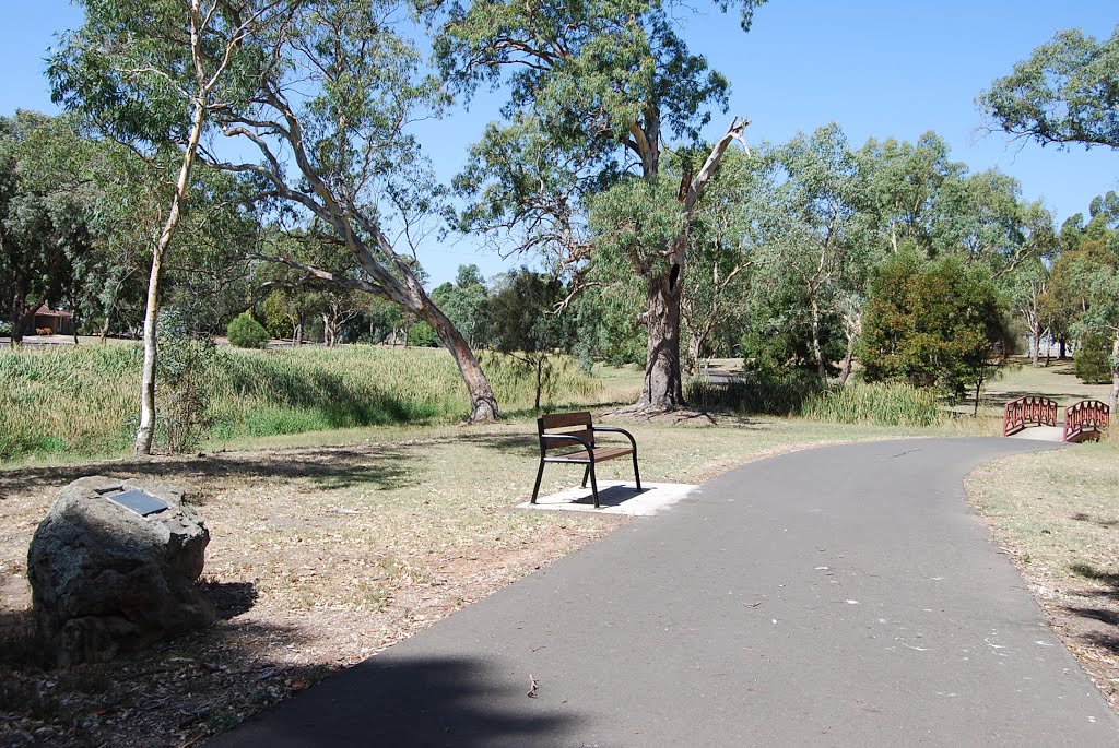 Monument by path across watercourse bridge by Phaedrus Fleurieu