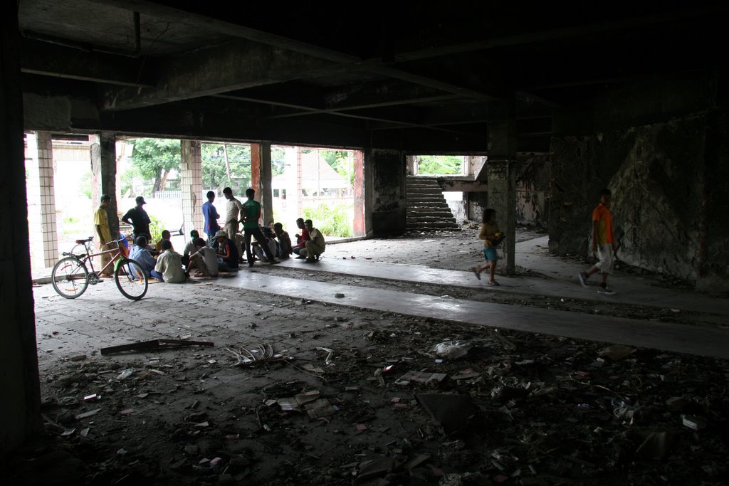 Dili, Timor-Leste: The destroyed Ministry of Finance building becomes a place for gambling. by Ian Stehbens