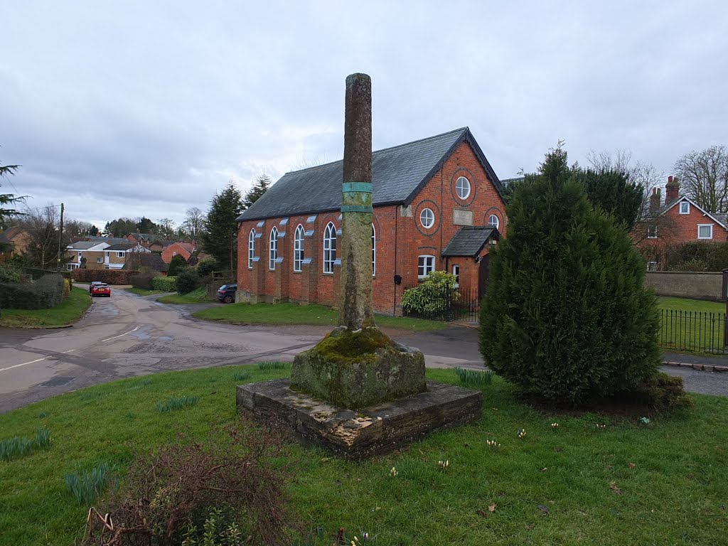 The 13th Century Market cross and Naseby village Methodist church. by Bobsky.