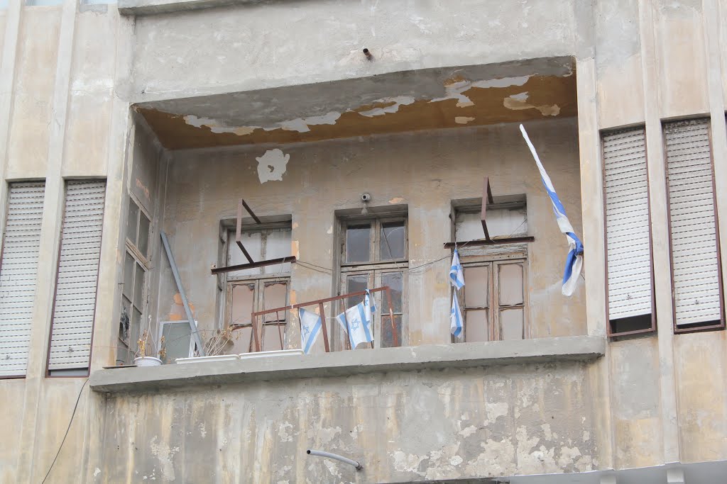 Israeli flags on a balcony in Jaffa. תל אביב יפו, ישראל by Genet