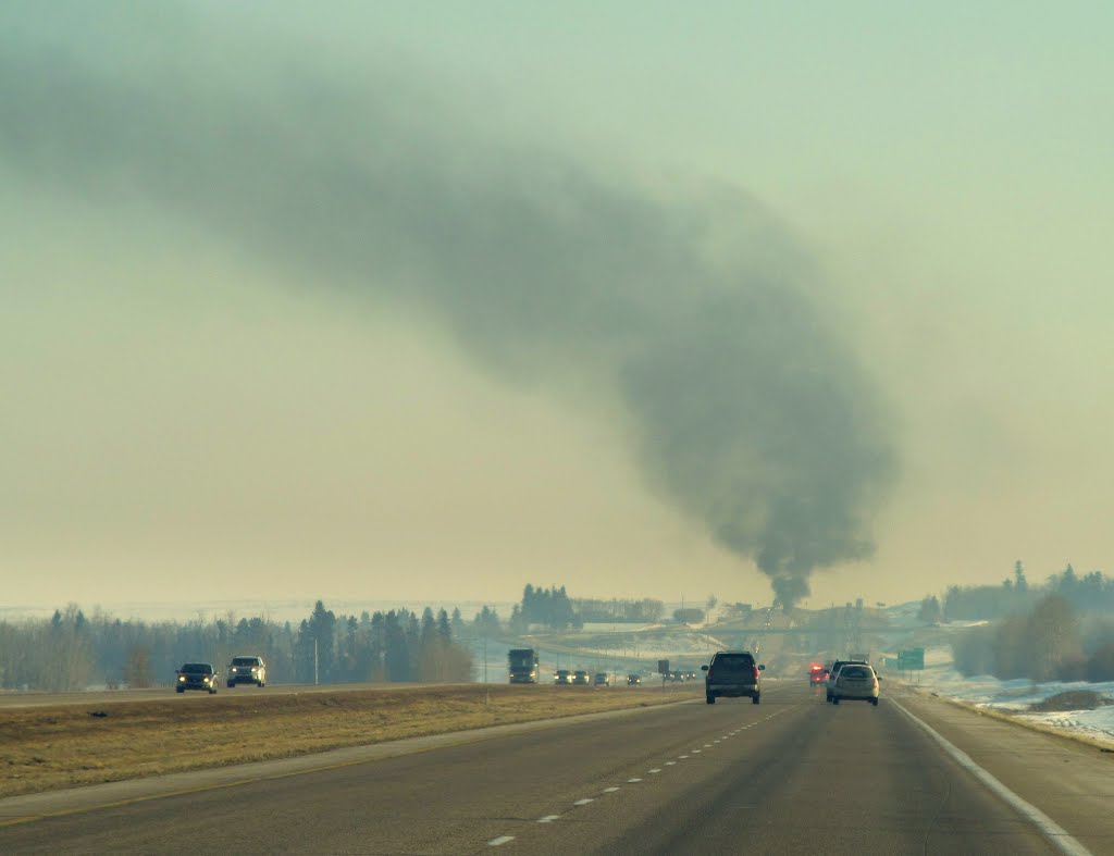 Driving Through The Prairie On The QEII With A Truck Fire Way In The Distance Near Ponoka AB South of Edmonton Mar '13 by David Cure-Hryciuk