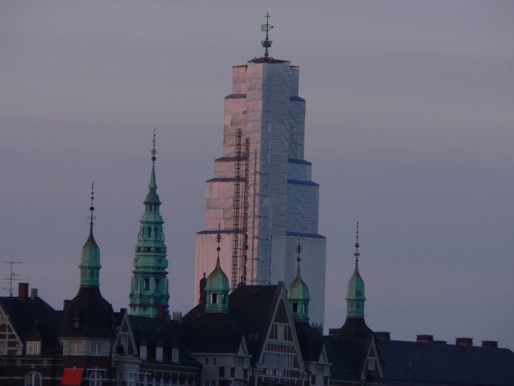 Copenhagen. Tower of the Paliament wrapped in plastics and some other old towers by thor☼odin™