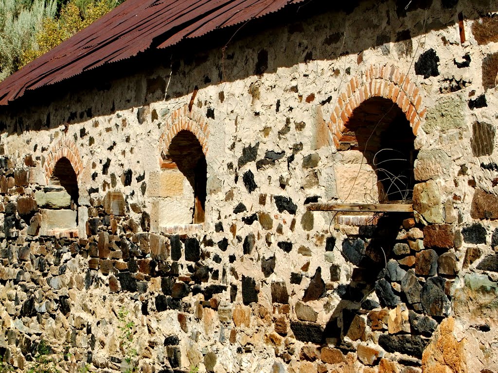 Old stone and cement mining building by Neale J