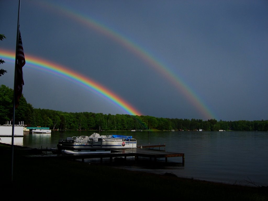 Rainbows on the lake by C. Baer