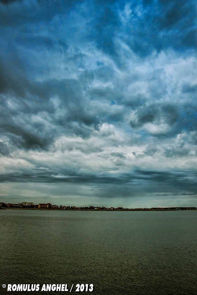 Mostly Cloudy / At Windmill Lake by Romulus Anghel