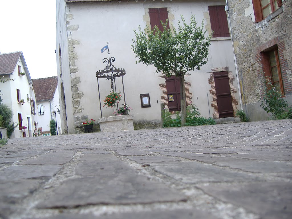 Tous les pavés mènent au puits by Florence Auburtin