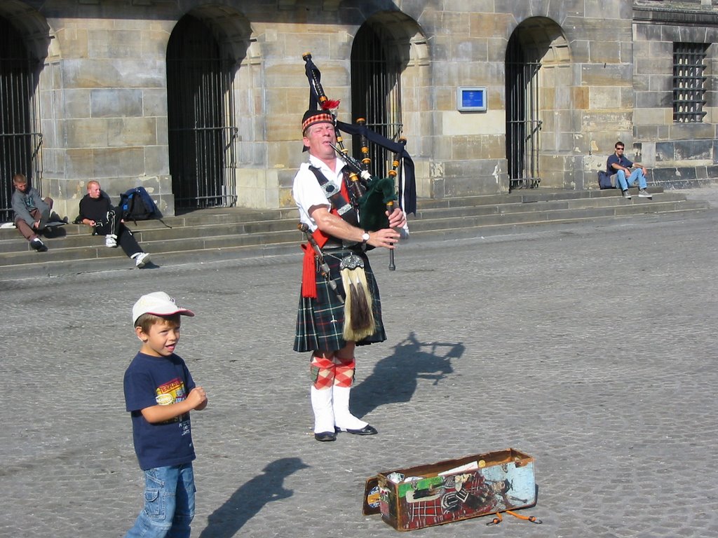 Amsterdam A Piper on the Dam by mikerogers