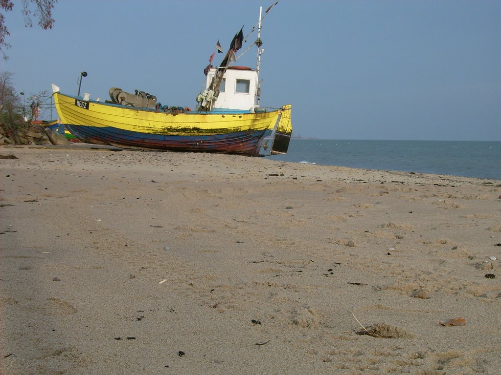 Fising boat at shore by szafranowicz