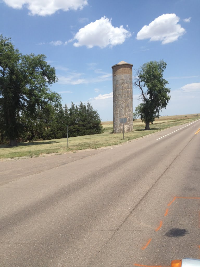 The old silos have out lasted the ways of farming. Now they are monuments to a forgotten time. by JBTHEMILKER