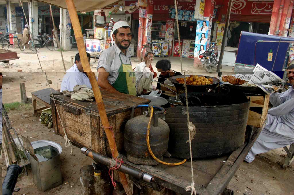 Village Life, Mohammad Shafiq, A Fresh Snack Seller on Wheel, Model Town, Gujranwala, Pakistan by Mohammad Aslam Javed Bhatti by Mohammad Aslam Javed…