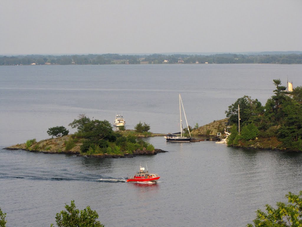 Snug harbor at the north end of Cedar Island, part of the Thousand Island National Parks. It has heavy duty docks, washrooms, picnic tables and fire pits. Park fees apply based on the size of the boat. by Steve Manders