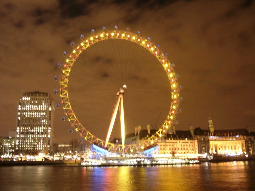 London Eye by night. Kind of blurry, but nice mood anyway by Ole Jonny Vik