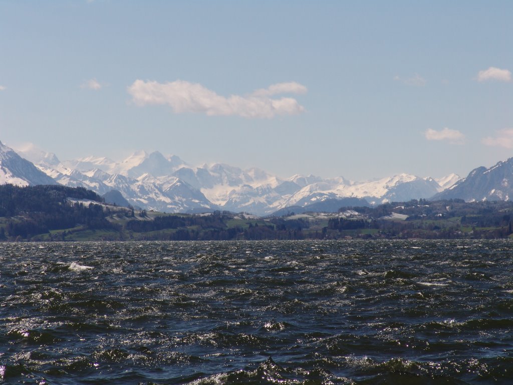 Snow mountains behind the Lake of Zug by beroarklinux