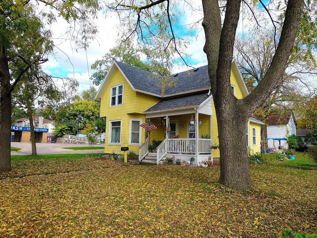 Yellow Queen Anne Style House by Corey Coyle