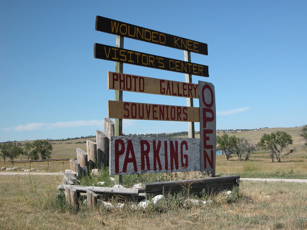 Sign in Front of the Visitor's Center at Wounded Knee, South Dakota by Seven Stars