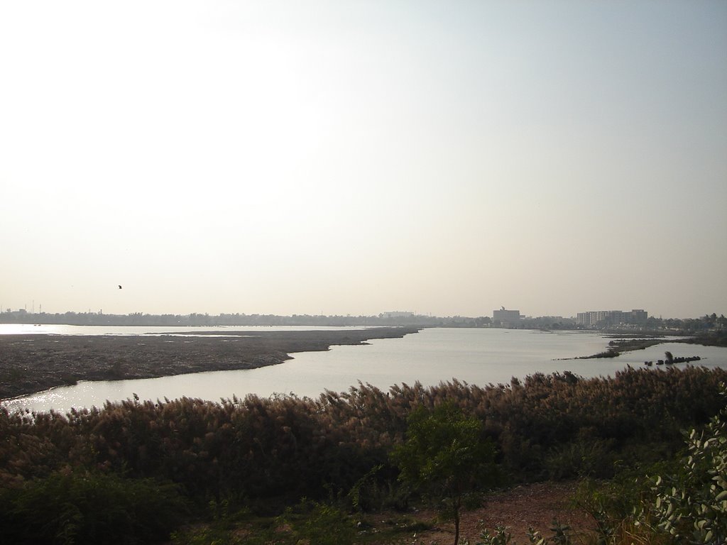 The water presents a look of a lake on the ground below Hill Top in Hyderabad, Sindh in Pakistan by Irfan_Rind