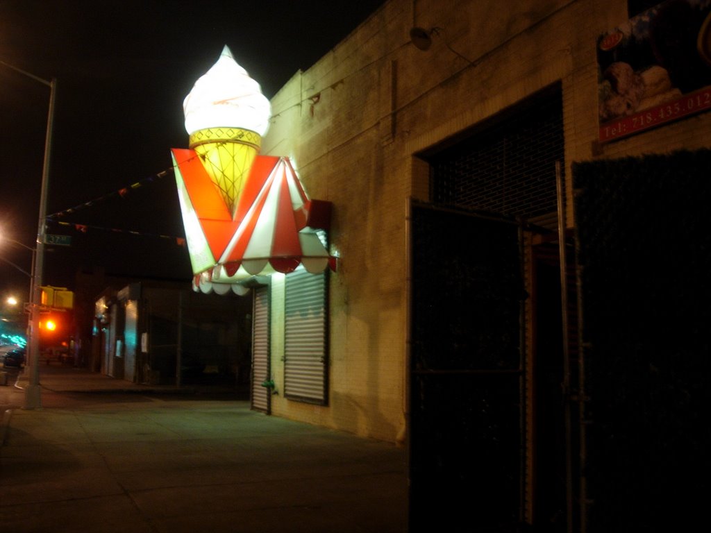 Ice cream cone at night by Aaron A