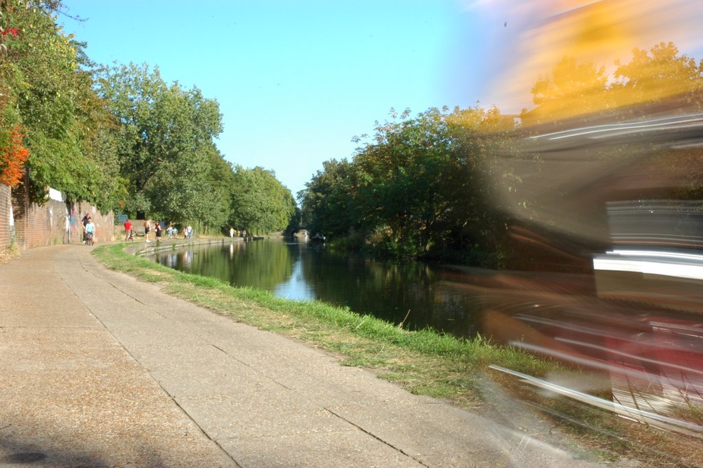 A cyclist on the towpath of a Canal In East London by Chris Bassett