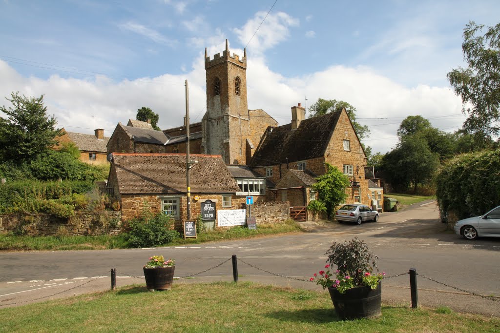 St. Martin's Church overlooks The George and Dragon and the green at Shutford, Oxfordshire by Roger Sweet